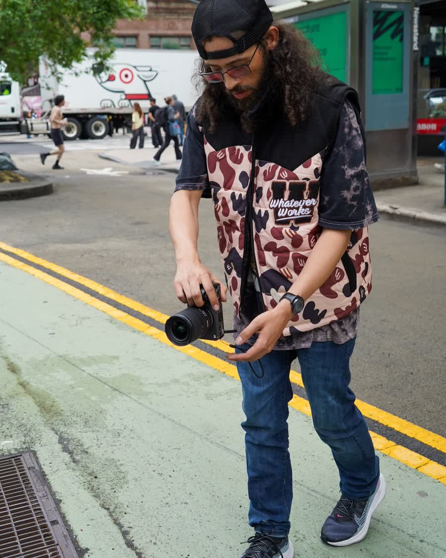 David Rodriguez checking a shot on a mirrorless camera on location